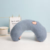 A cozy U-shaped neck pillow for pets, providing support for deep sleep and a comfy headrest.